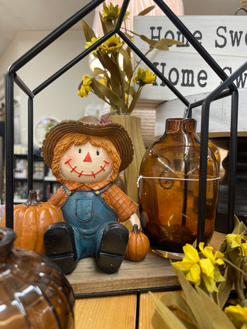Sitting Scarecrow with Pumpkins